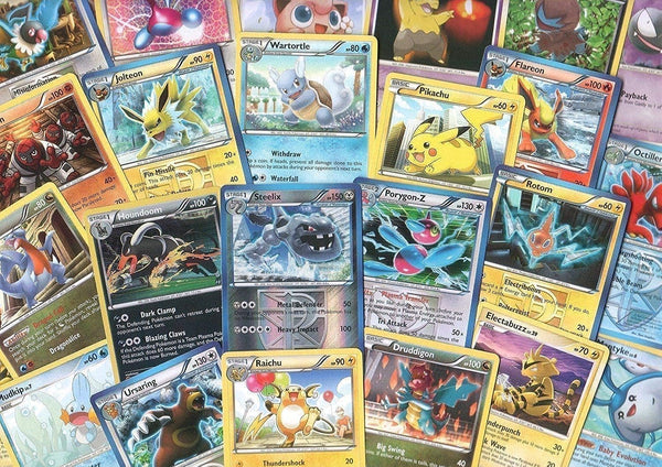 100 Assorted Pokemon Trading Cards with 7 Bonus Holo Foils