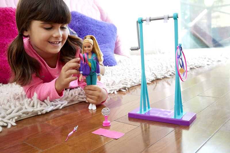 Barbie GBK59 Team Stacie Doll and Gymnastics Playset with Spinning Bar and 7 Themed Accessories, Multicoloured